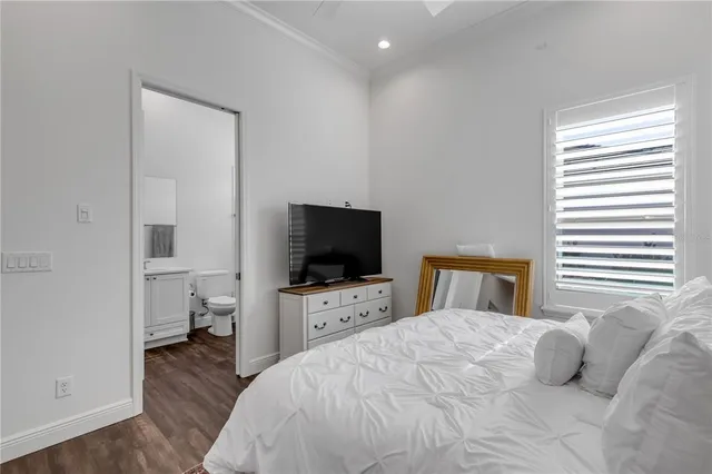 a view of a lake with tables and chairs