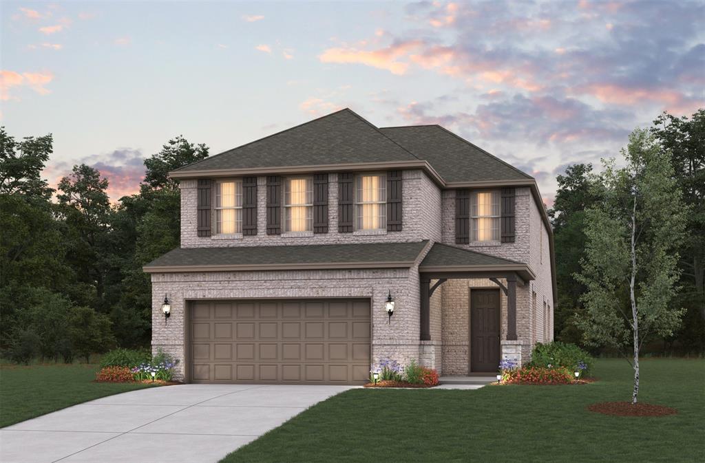 a front view of a house with a garden and trees