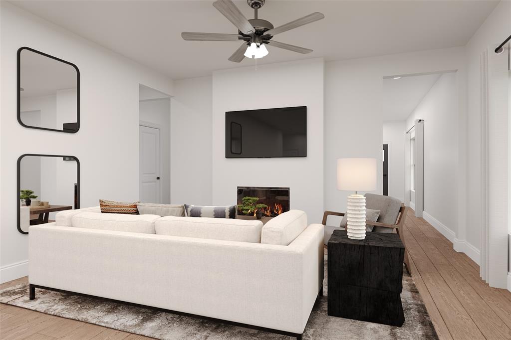 8712 Saratoga Street Pilot Point, TX 76258 - Photo 3 of 7 a living room with furniture a fireplace and a flat screen tv