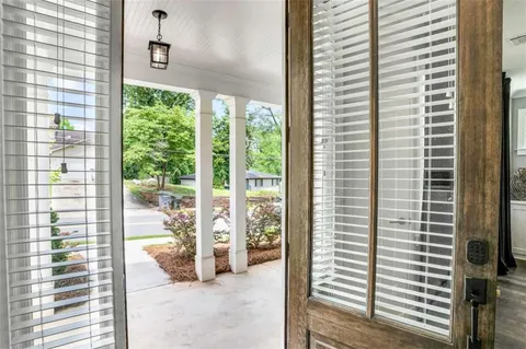 a view of a living room and a balcony