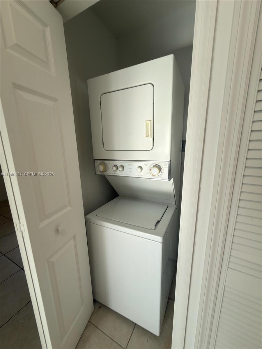930 Northeast 34th Avenue, Unit 201 Homestead, FL 33033 - Photo 26 of 26 a utility room with dryer and washer