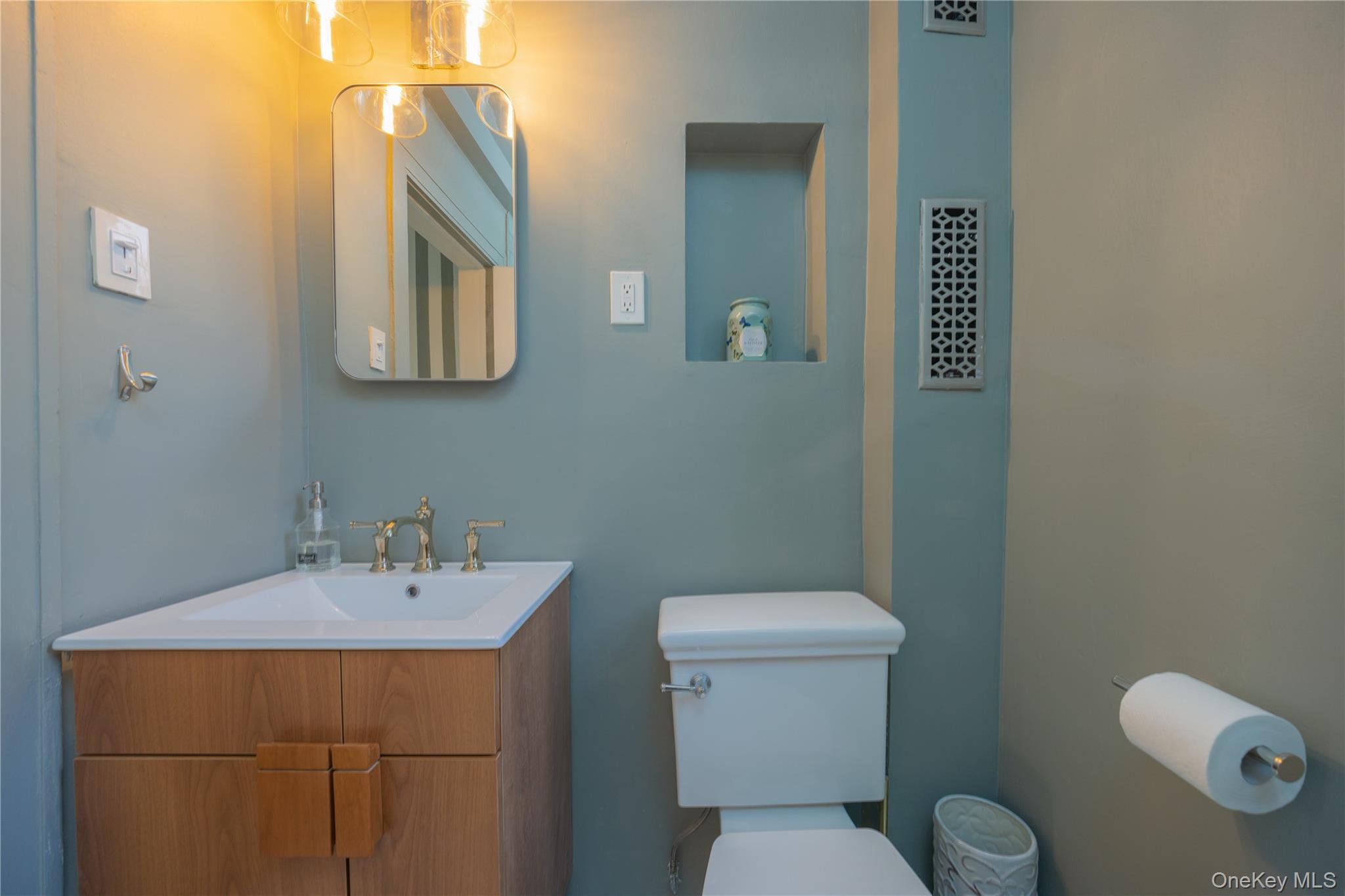 824 Bronx River Road, Unit 4B Bronxville, NY 10708 - Photo 16 of 31 a bathroom with a toilet sink and mirror