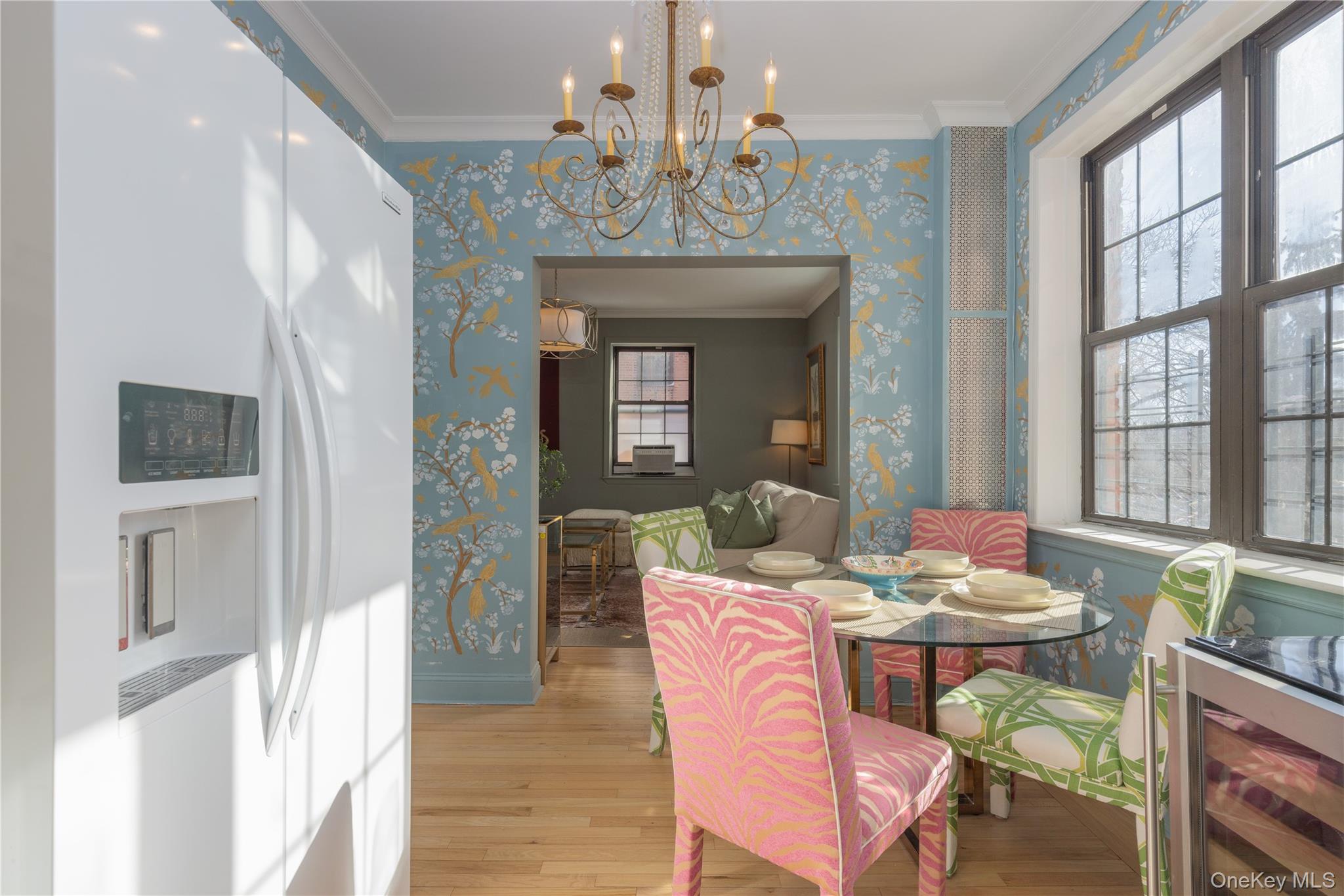 824 Bronx River Road, Unit 4B Bronxville, NY 10708 - Photo 7 of 31 a view of a dining room with furniture a chandelier and wooden floor