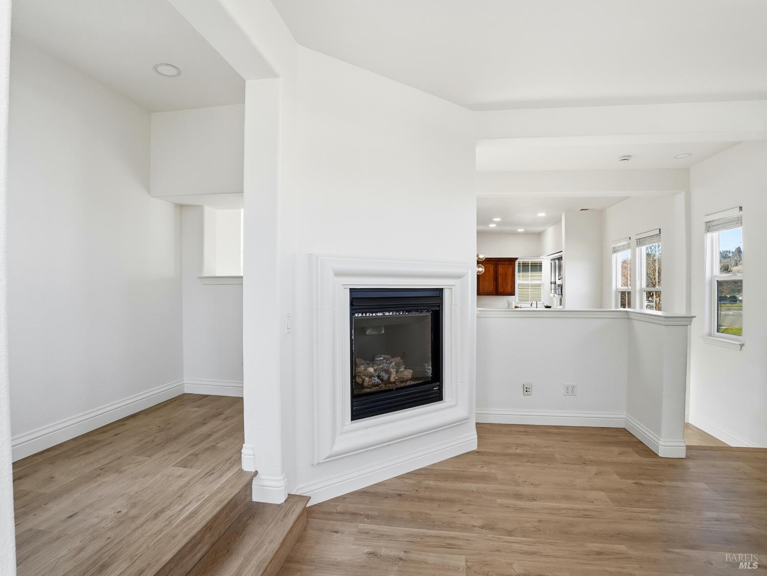 4424 Streamside Drive Santa Rosa, CA 95409 - Photo 11 of 55 a view of a livingroom with wooden floor and a fireplace
