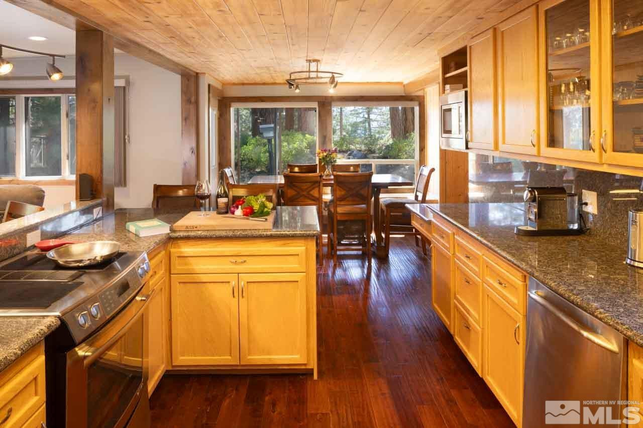 633 Riven Rock Road Zephyr Cove, NV 89448 - Photo 11 of 41 a kitchen with counter top space and wooden floor