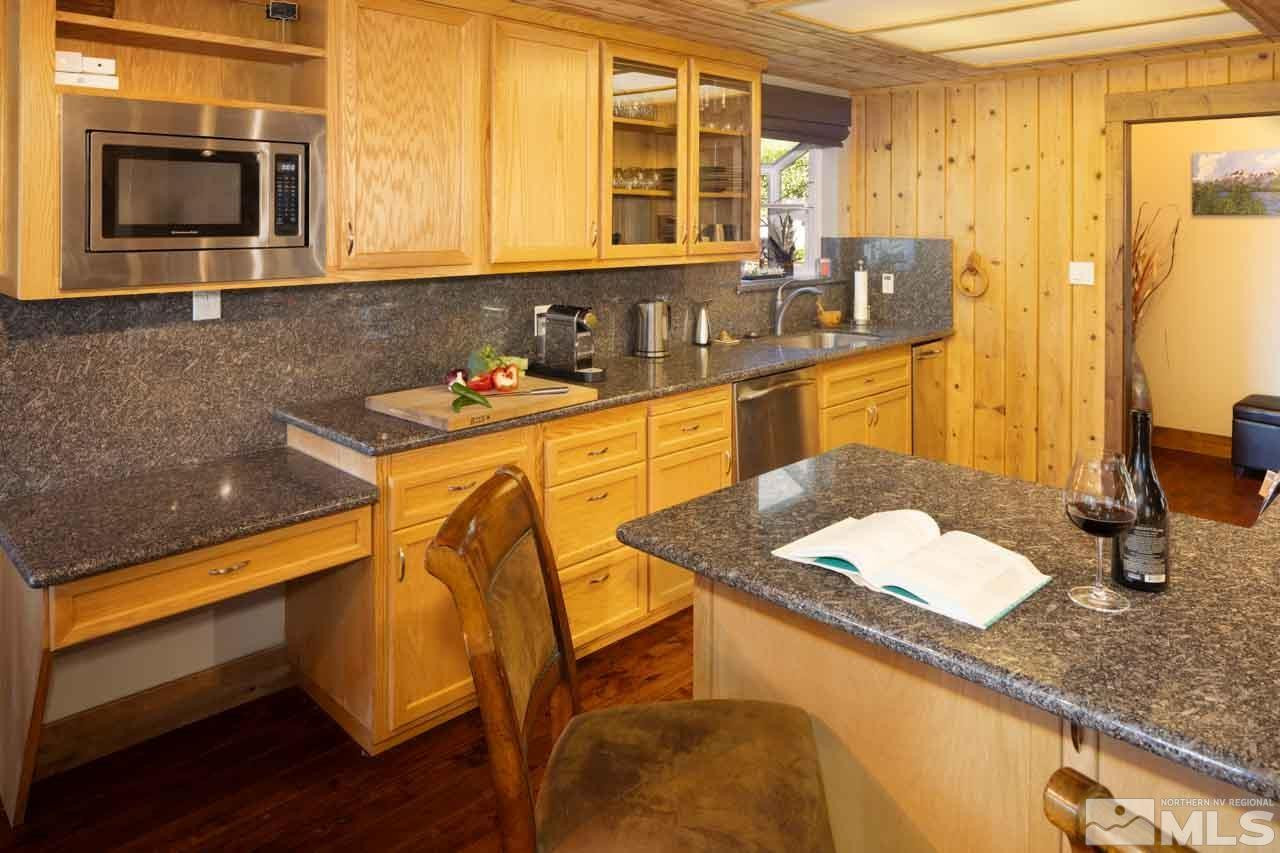 633 Riven Rock Road Zephyr Cove, NV 89448 - Photo 14 of 41 a kitchen with a sink and a microwave
