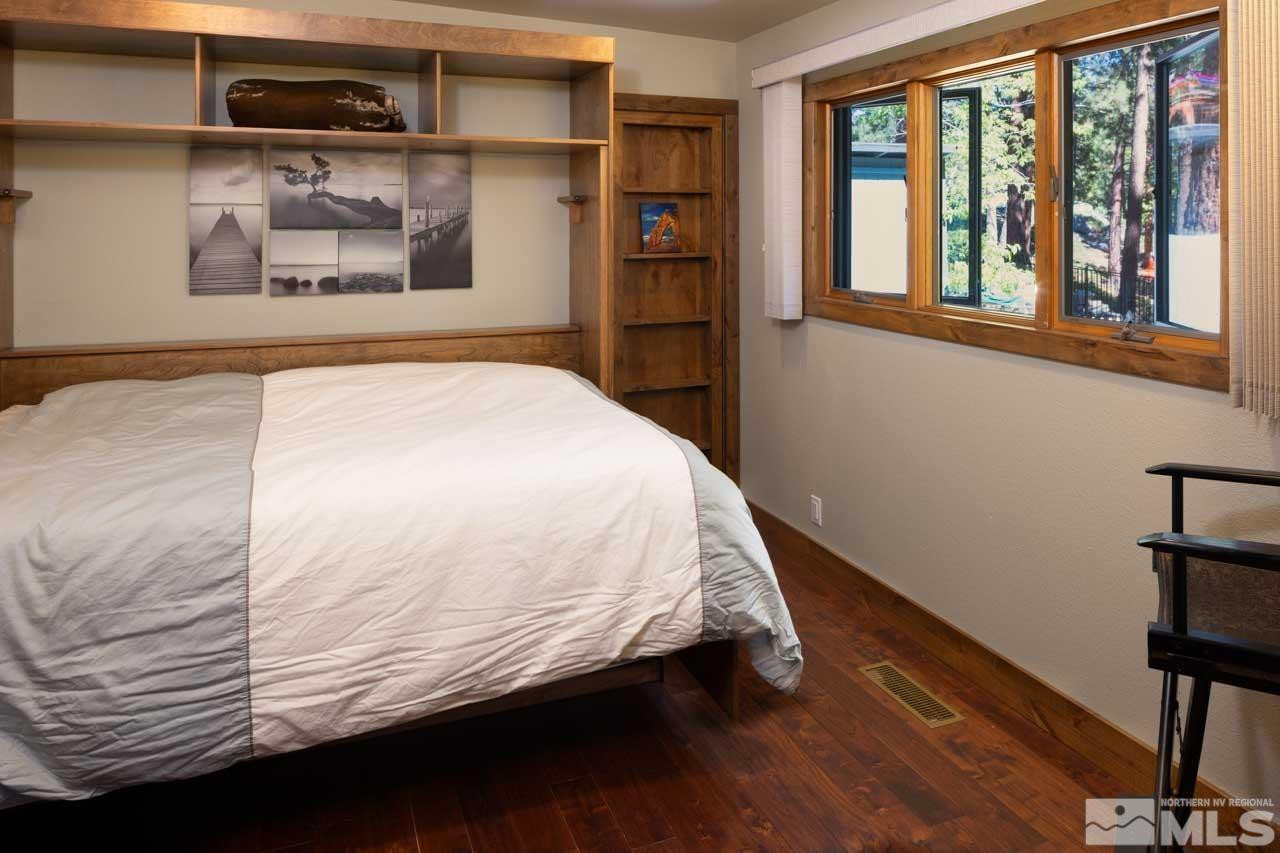 633 Riven Rock Road Zephyr Cove, NV 89448 - Photo 16 of 41 a bedroom with a bed and a painting on the wall