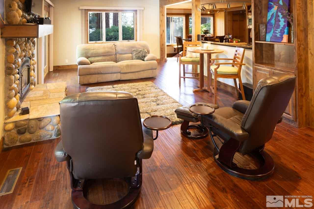 633 Riven Rock Road Zephyr Cove, NV 89448 - Photo 9 of 41 a living room with furniture and a fireplace