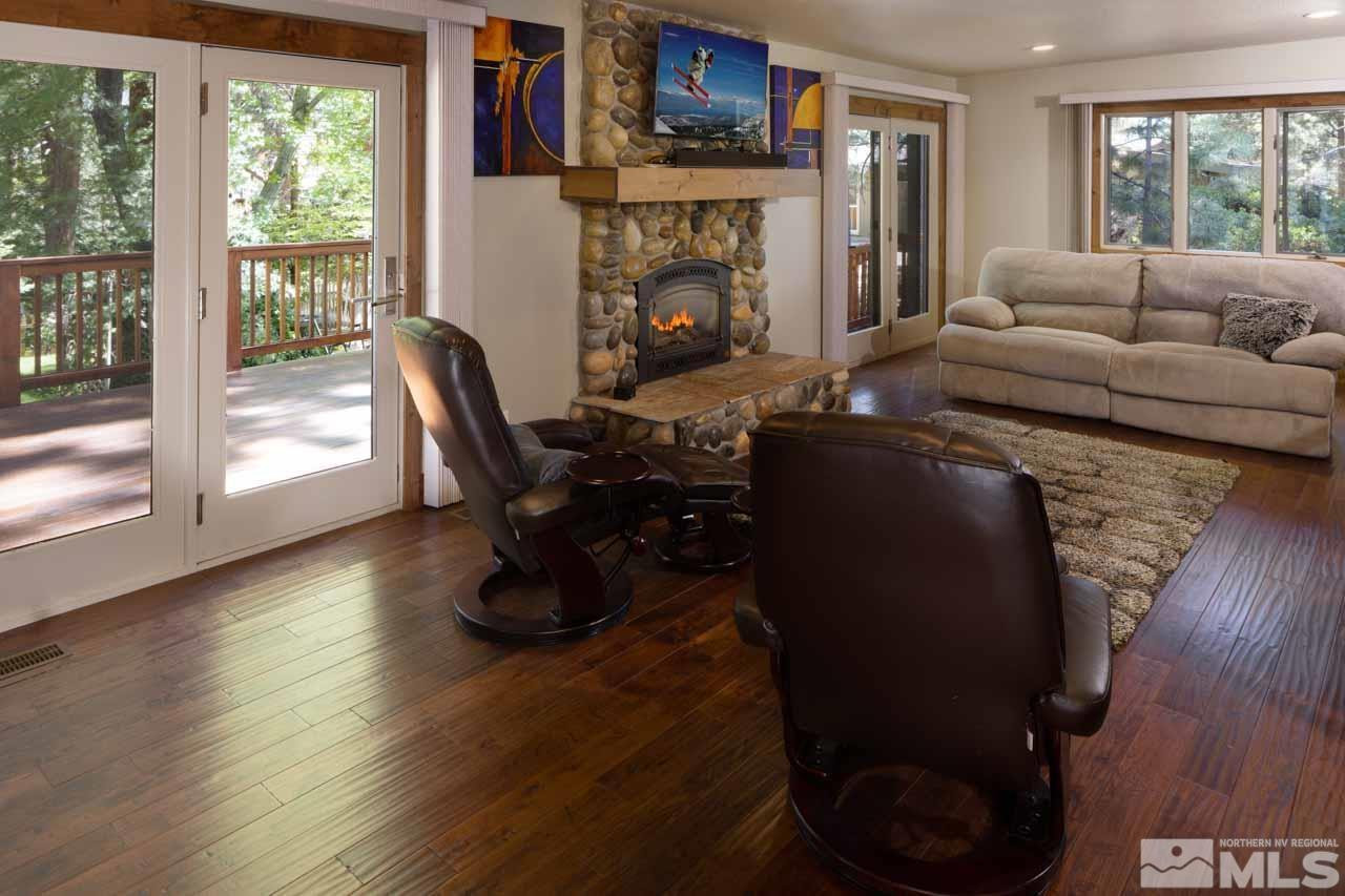 633 Riven Rock Road Zephyr Cove, NV 89448 - Photo 10 of 41 a living room with furniture and a fireplace
