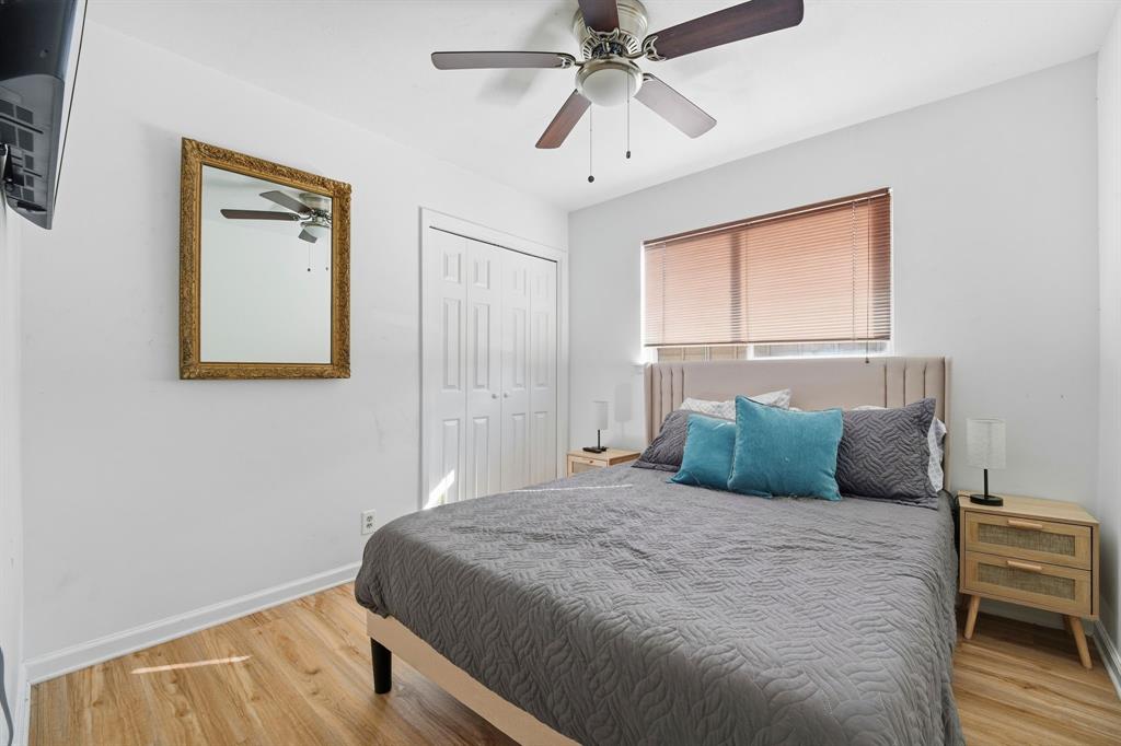 802 Buckingham Place Austin, TX 78745 - Photo 14 of 21 a bedroom with a large bed and a window