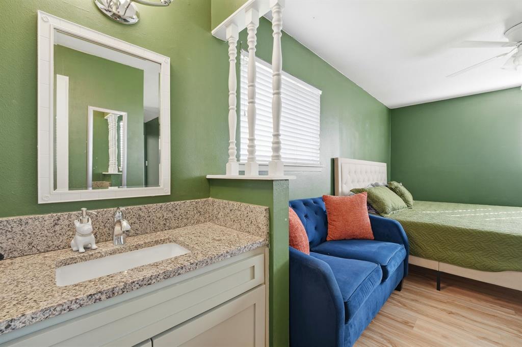 802 Buckingham Place Austin, TX 78745 - Photo 17 of 21 a bathroom with a granite countertop sink and a bathtub