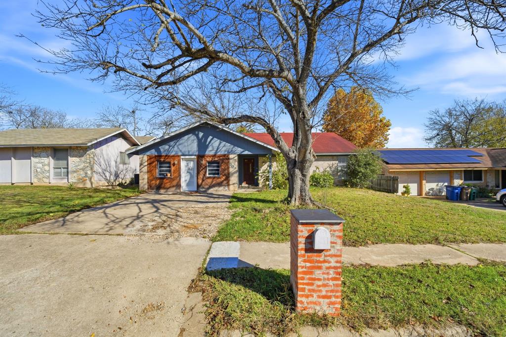 802 Buckingham Place Austin, TX 78745 - Photo 2 of 21 front view of house with a yard