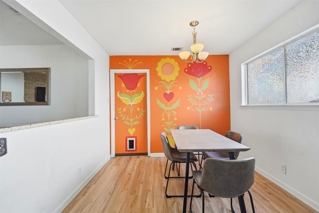 802 Buckingham Place Austin, TX 78745 - Photo 8 of 21 a view of a dining room with furniture and wooden floor