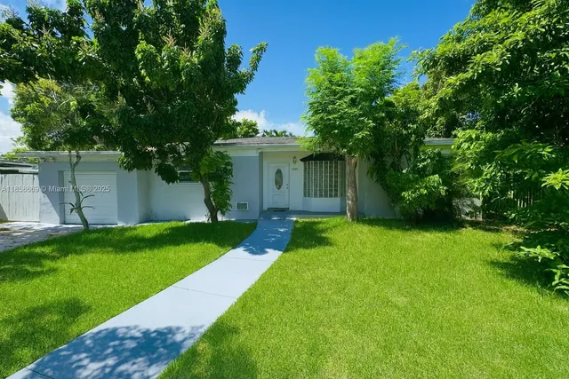 a view of a backyard with a small cabin