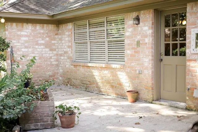 a view of a porch with potted plants