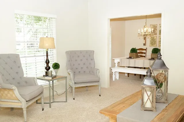 a living room with furniture and a window