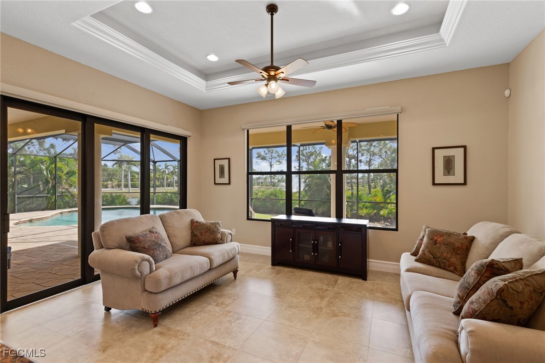6057 Calusa Rdg Trail Bokeelia, FL 33922 - Photo 12 of 45 a living room with furniture and a large window