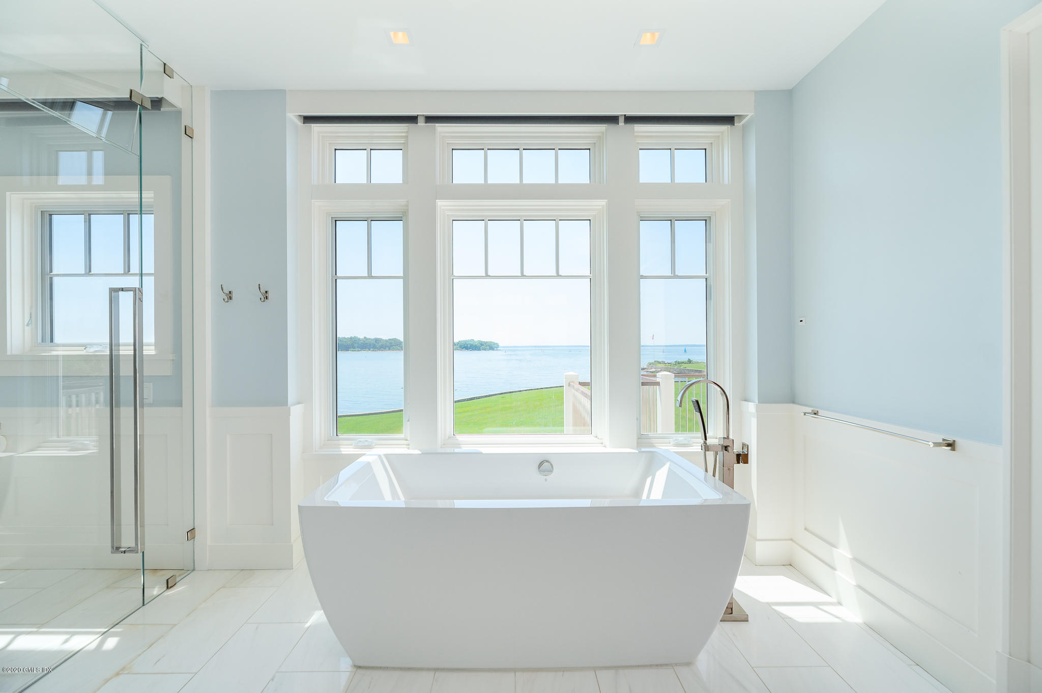 22 Pilot Rock Lane Riverside, CT 06878 - Photo 19 of 40 a living room with a large window and a bathtub