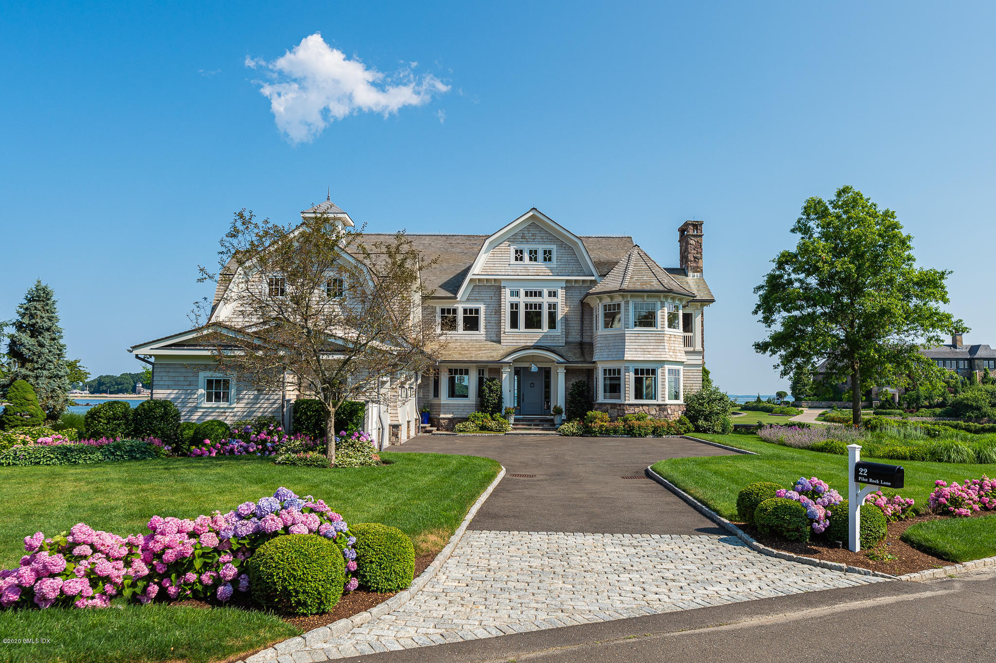 22 Pilot Rock Lane Riverside, CT 06878 - Photo 2 of 40 a front view of a house with a garden