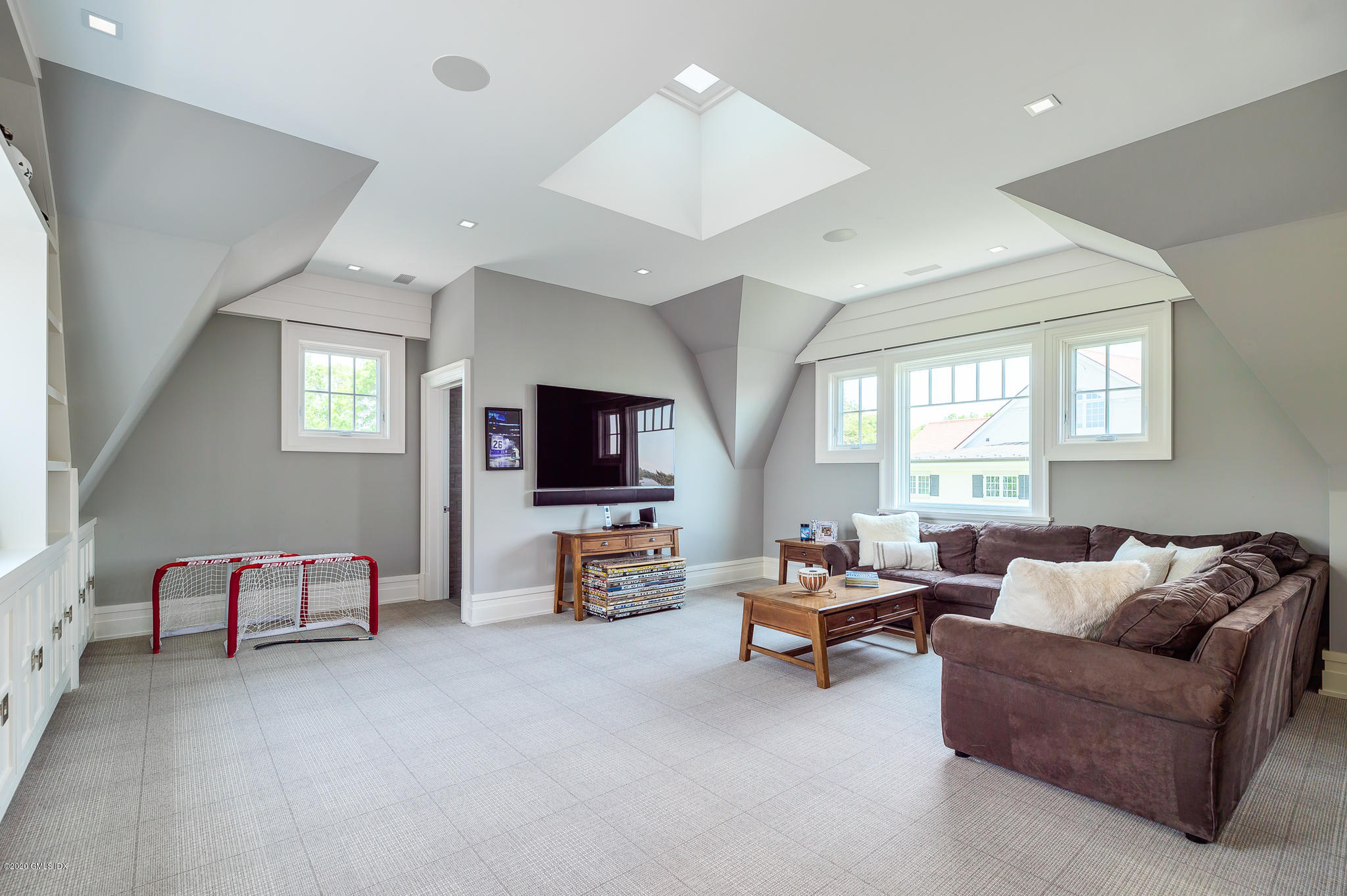 22 Pilot Rock Lane Riverside, CT 06878 - Photo 23 of 40 a living room with furniture window and a flat screen tv