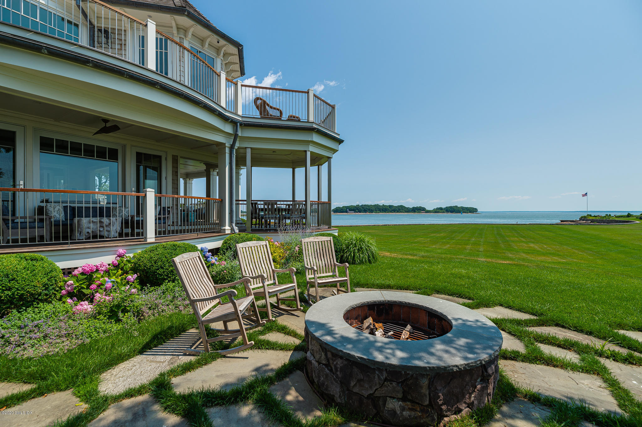 22 Pilot Rock Lane Riverside, CT 06878 - Photo 31 of 40 a view of a table and chairs in patio with a yard