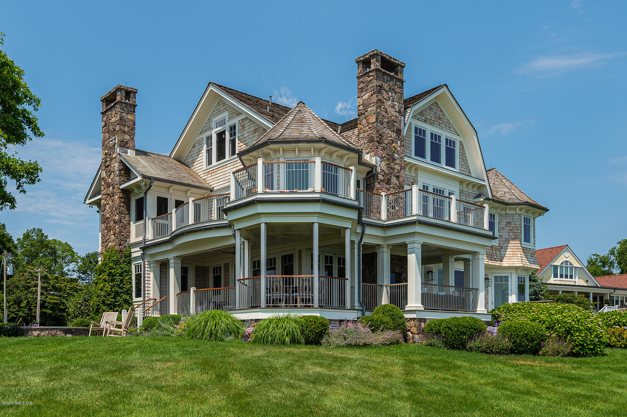 22 Pilot Rock Lane Riverside, CT 06878 - Photo 32 of 40 a front view of a house with a garden and plants