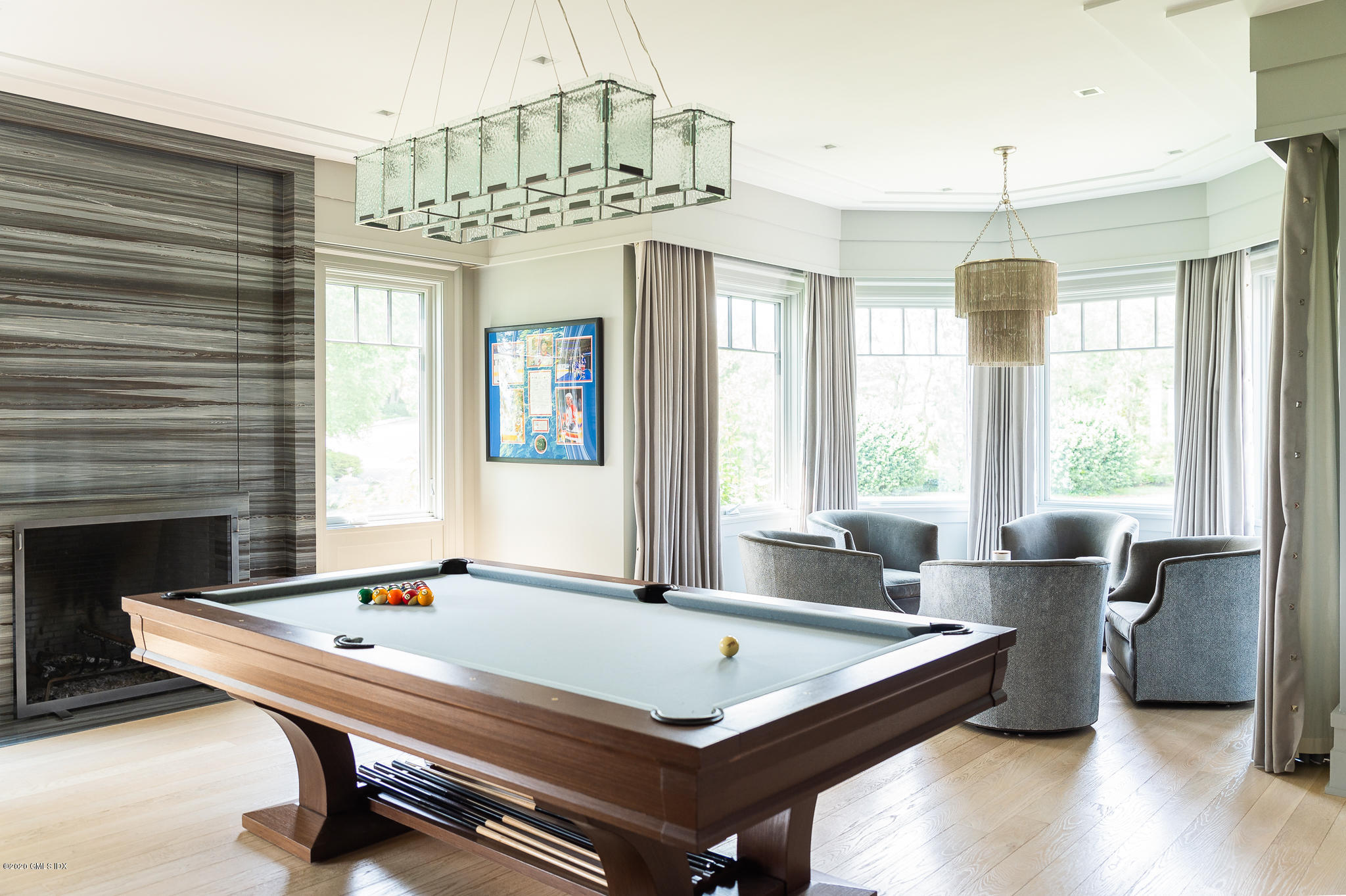 22 Pilot Rock Lane Riverside, CT 06878 - Photo 5 of 40 a living room with a table chairs and a chandelier