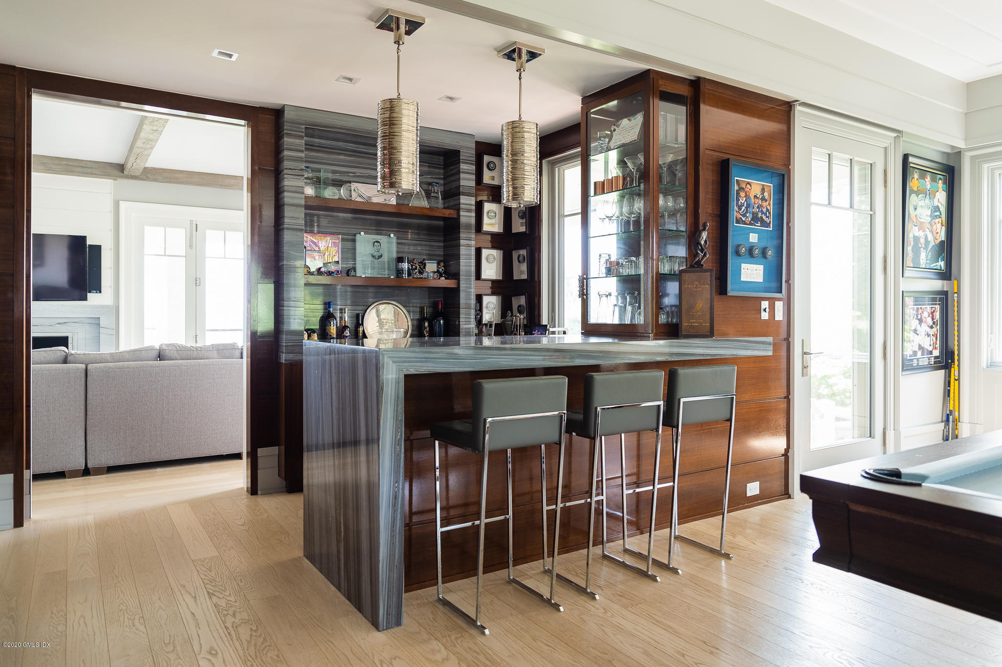 22 Pilot Rock Lane Riverside, CT 06878 - Photo 7 of 40 a kitchen with stainless steel appliances granite countertop a refrigerator and wooden cabinets
