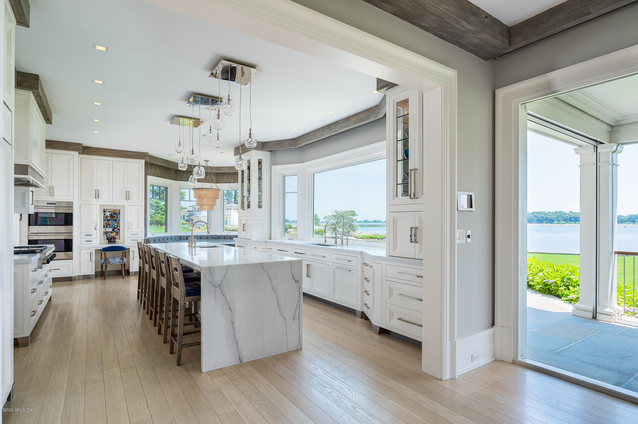 22 Pilot Rock Lane Riverside, CT 06878 - Photo 10 of 40 a kitchen with counter top space and wooden floor