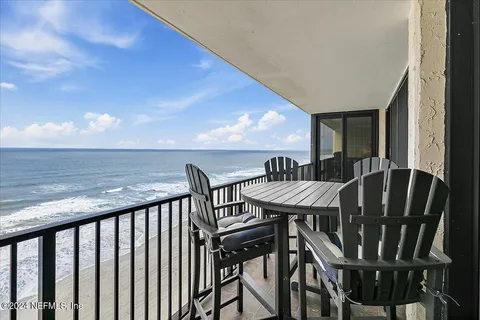 a view of a balcony dining area