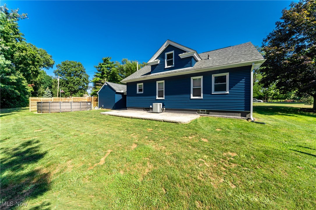 33384 Chestnut Ridge Road North Ridgeville, OH 44039 - Photo 29 of 30 Rear view of house featuring a patio area and roof with shingles