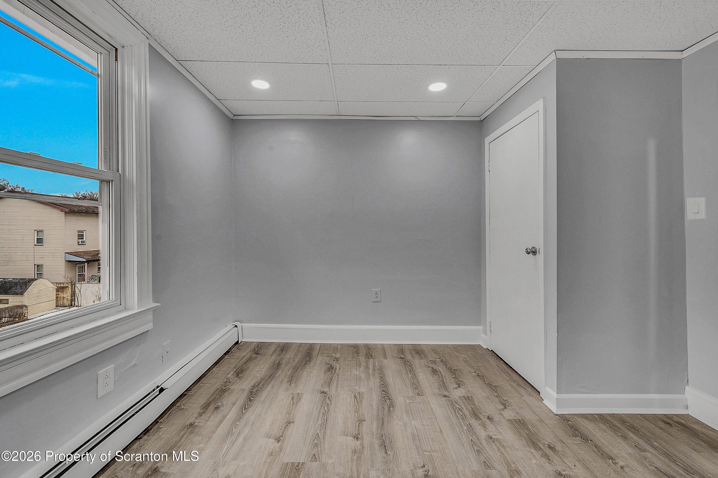 8 Green Ridge Street, Unit 2 Scranton, PA 18509 - Photo 12 of 18 a view of a room with wooden floor and windows