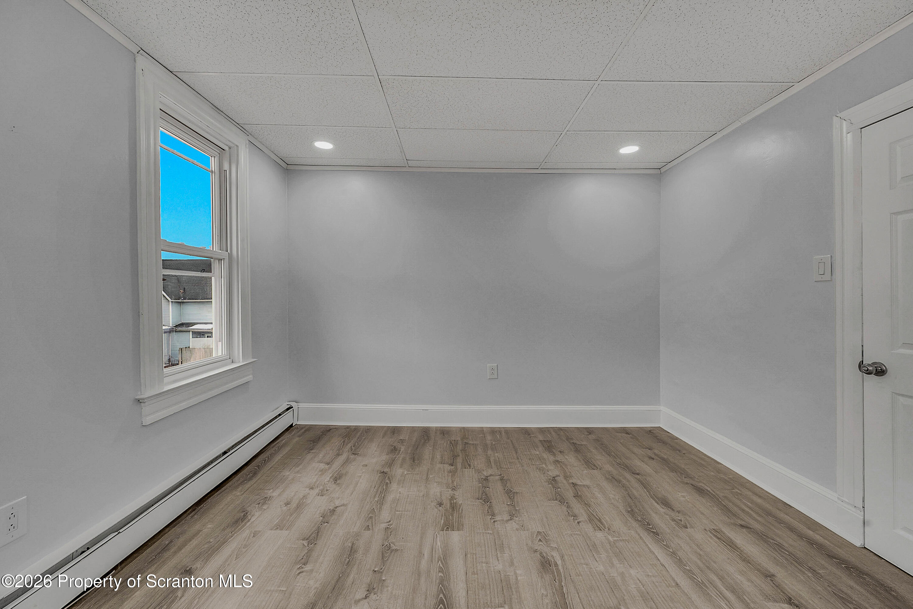 8 Green Ridge Street, Unit 2 Scranton, PA 18509 - Photo 14 of 18 a view of room with window and hardwood floor