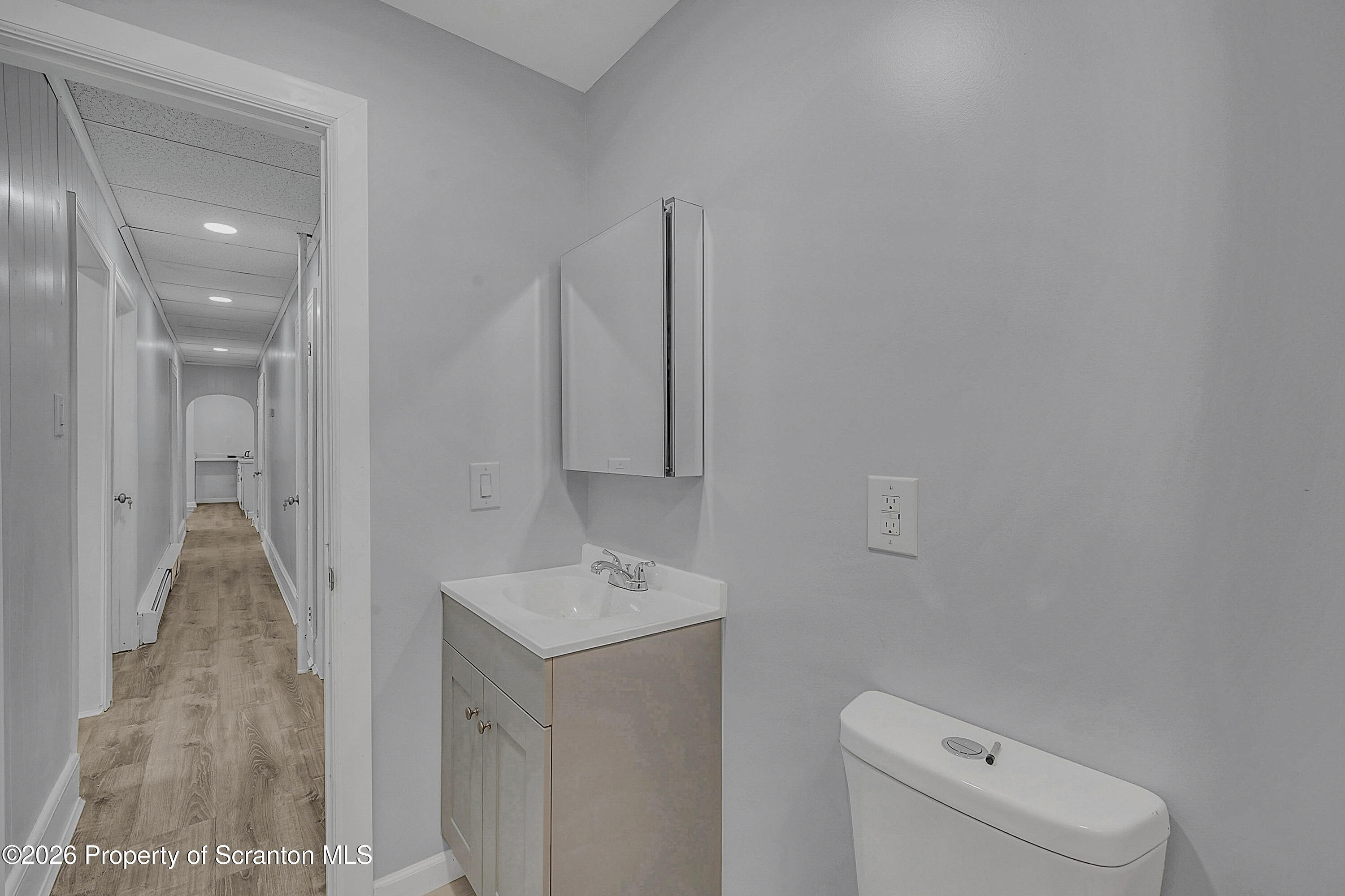 8 Green Ridge Street, Unit 2 Scranton, PA 18509 - Photo 10 of 18 a bathroom with a sink a toilet and shower