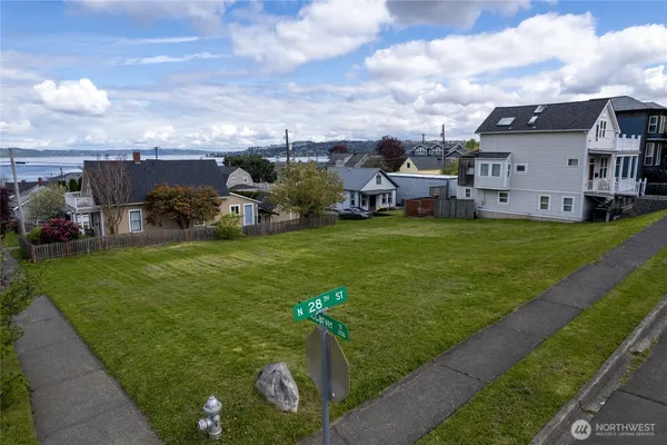 a view of a garden with houses
