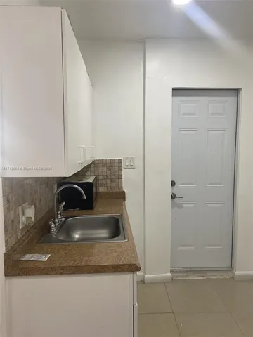 a close view of a sink and dishwasher