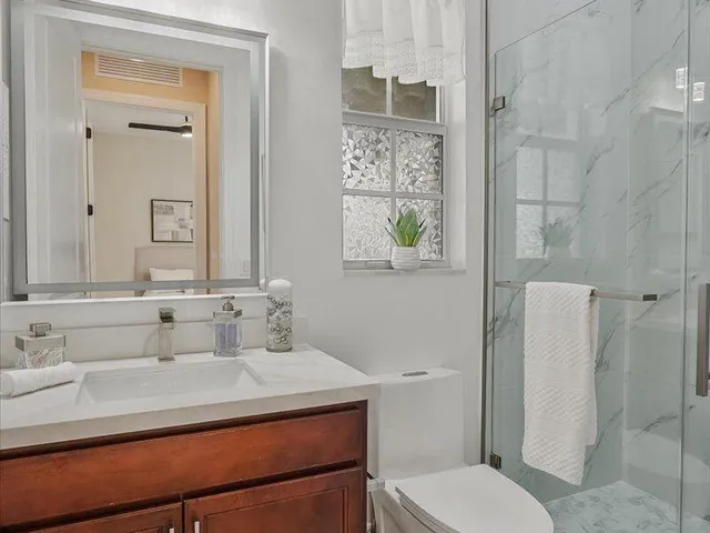 a bedroom with a large bed and a flat screen tv