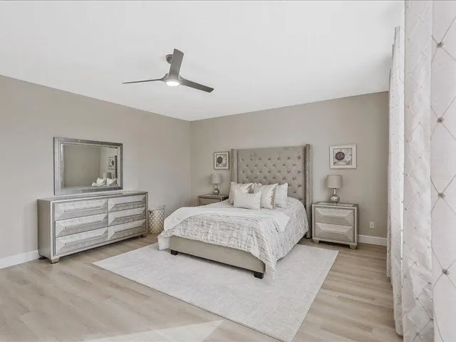 a view of a house with backyard sitting area and porch