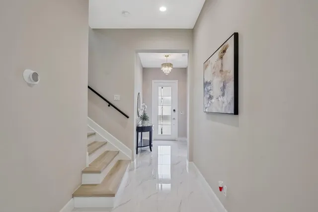 a view of entryway with stairs and wooden floor