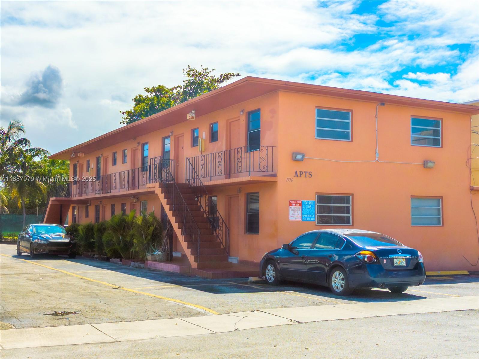 1736 Northwest 19th Street, Unit 5 Miami, FL 33125 - Photo 9 of 9 a front view of a house with a yard