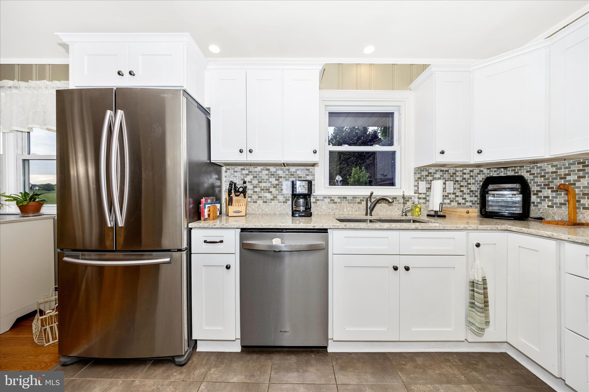 4432 Valley View Road Middletown, MD 21769 - Photo 13 of 54 a kitchen with stainless steel appliances a refrigerator sink and cabinets