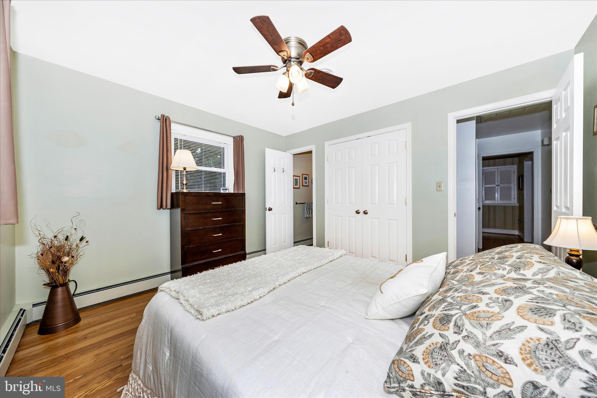 4432 Valley View Road Middletown, MD 21769 - Photo 17 of 54 a bedroom with a bed and a chandelier