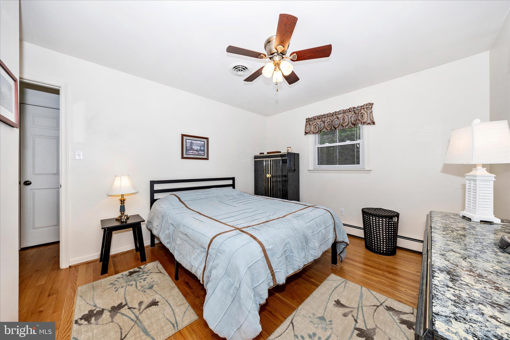 4432 Valley View Road Middletown, MD 21769 - Photo 21 of 54 a bedroom with a bed and wooden floor