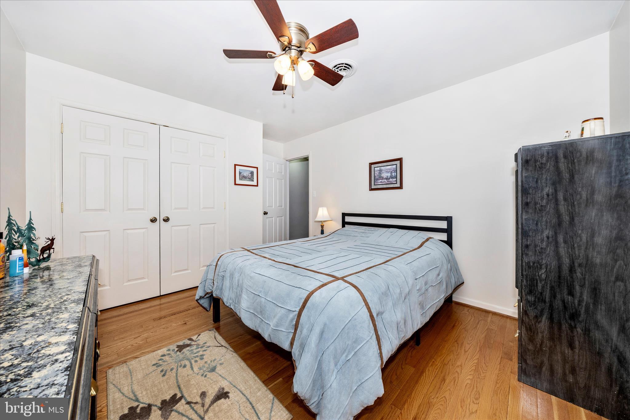 4432 Valley View Road Middletown, MD 21769 - Photo 22 of 54 a bedroom with a bed and a chandelier