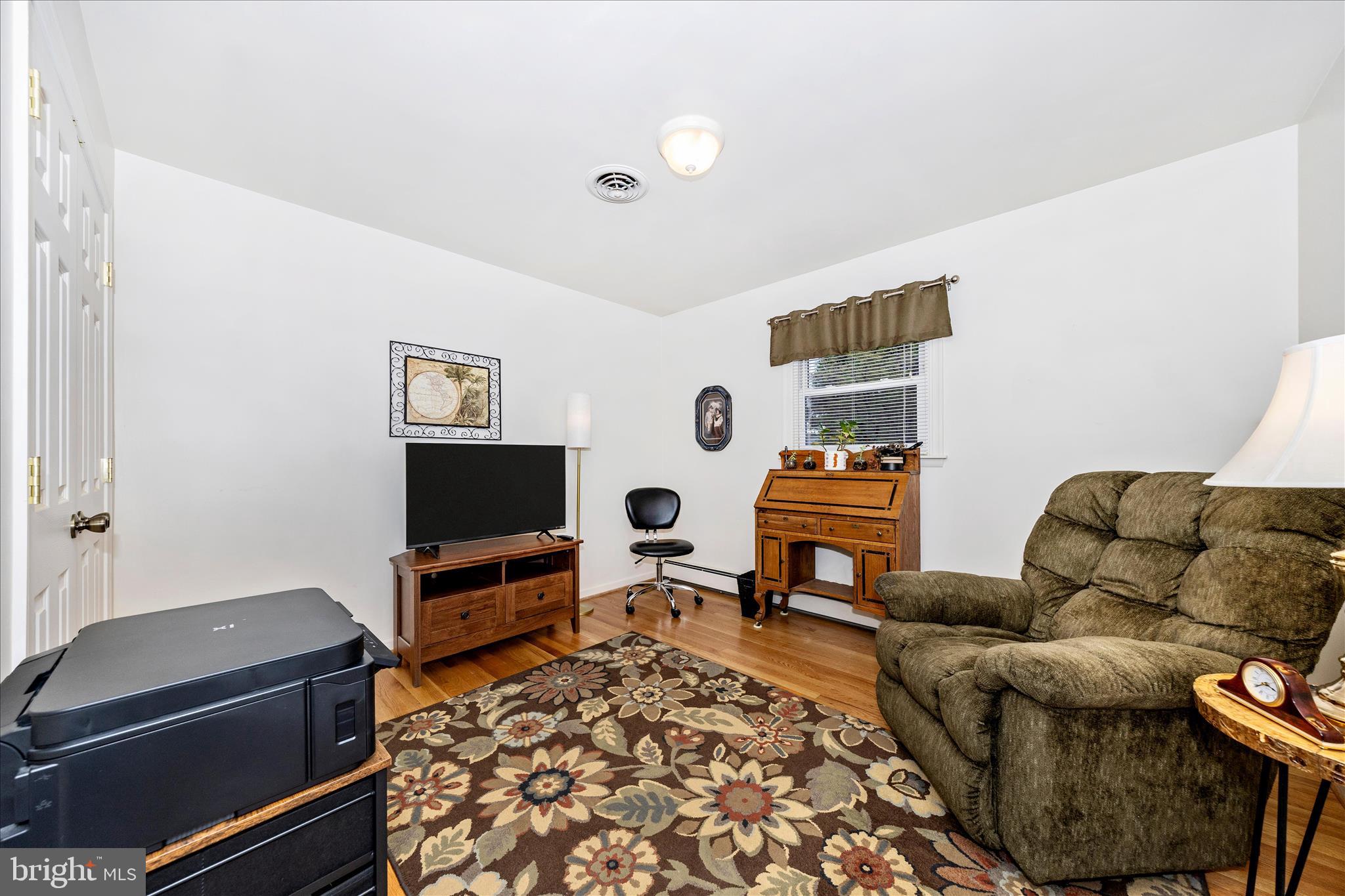 4432 Valley View Road Middletown, MD 21769 - Photo 23 of 54 a living room with furniture and a flat screen tv