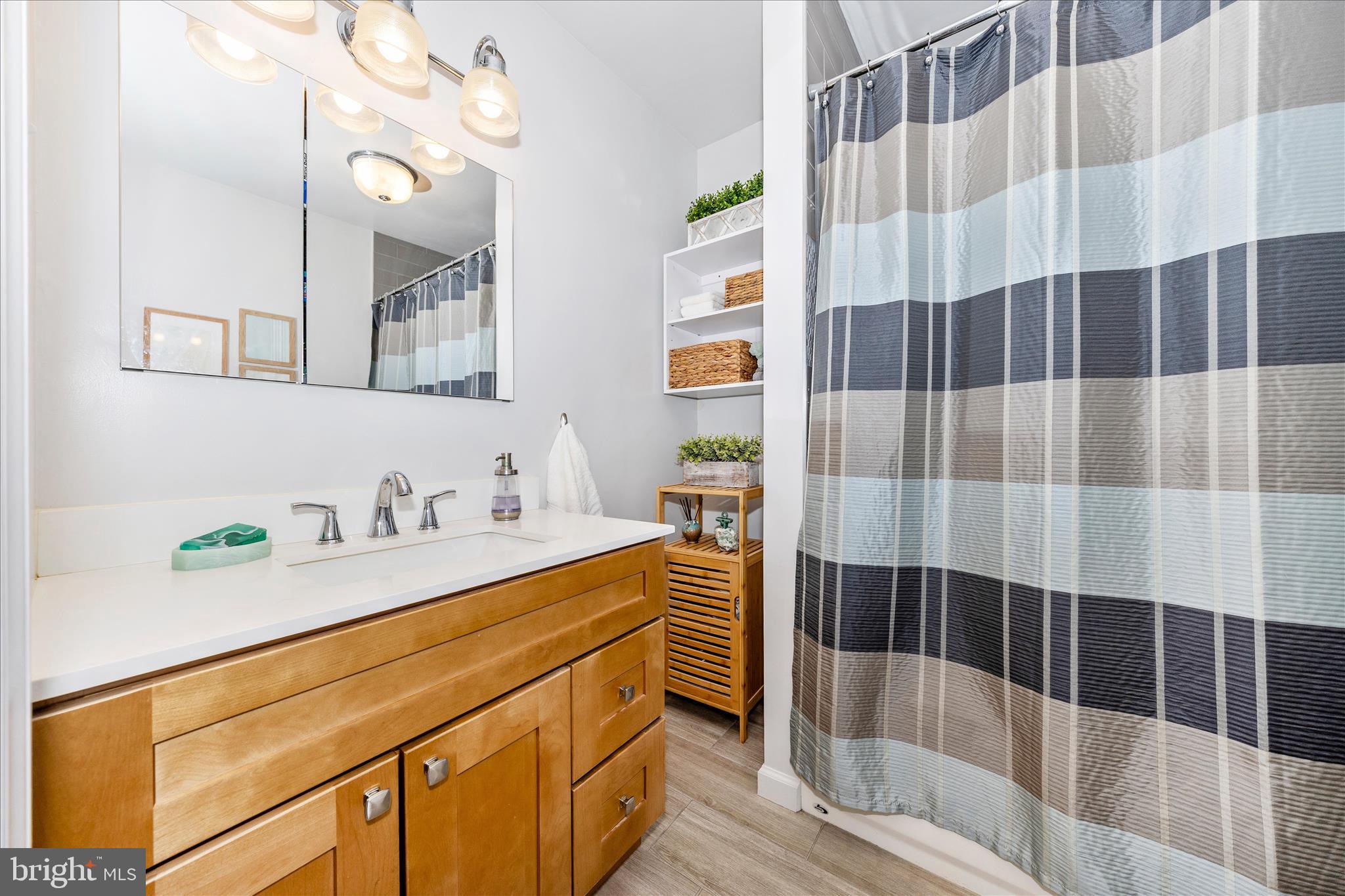 4432 Valley View Road Middletown, MD 21769 - Photo 27 of 54 a bathroom with a sink a toilet a shower and a mirror