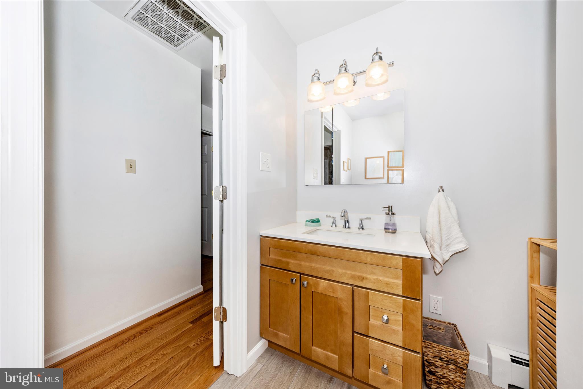 4432 Valley View Road Middletown, MD 21769 - Photo 28 of 54 a bathroom with a sink vanity and mirror
