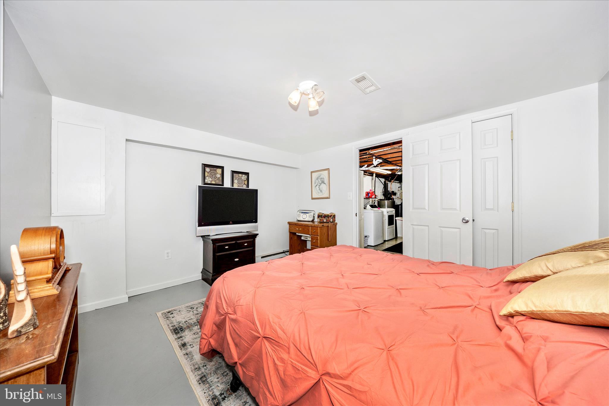4432 Valley View Road Middletown, MD 21769 - Photo 33 of 54 a bedroom with a bed and a flat screen tv