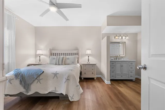 a bedroom with a bed and a lamp