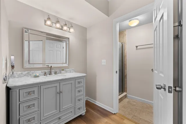 a bathroom with a double vanity sink and mirror